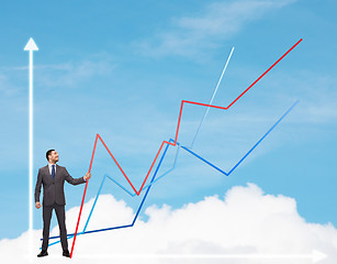 Image showing smiling man holding graph line