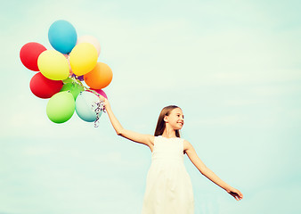 Image showing happy girl with colorful balloons