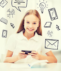 Image showing girl with smartphone at school