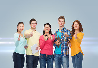 Image showing group of teenagers with smartphones and tablet pc