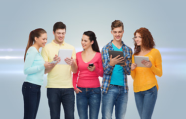 Image showing group of teenagers with smartphones and tablet pc