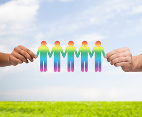 Image showing close up of hands holding paper chain gay people