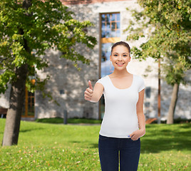 Image showing smiling young woman in blank white t-shirt