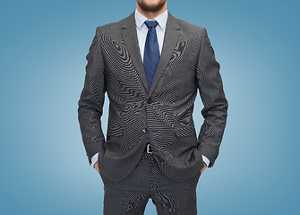 Image showing close up of businessman over blue background