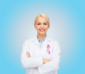 Image showing smiling female doctor with cancer awareness ribbon