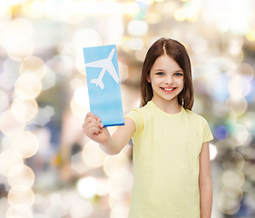 Image showing smiling little girl with airplane ticket