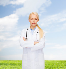 Image showing serious female doctor with stethoscope