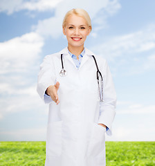 Image showing smiling female doctor with stethoscope