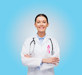 Image showing doctor with stethoscope, cancer awareness ribbon