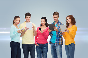 Image showing group of teenagers with smartphones and tablet pc