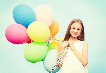 Image showing happy girl with colorful balloons