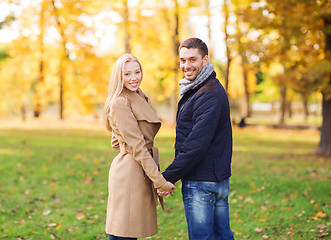 Image showing smiling couple in autumn park