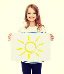 Image showing smiling little child holding picture of sun