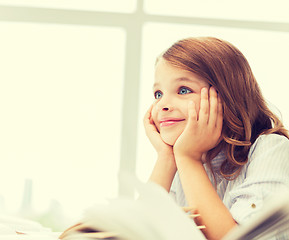 Image showing student girl writing in notebook at school