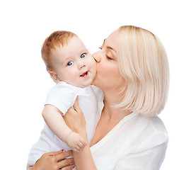 Image showing happy mother kissing smiling baby