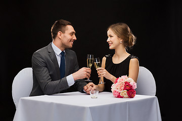 Image showing couple with glasses of champagne at restaurant