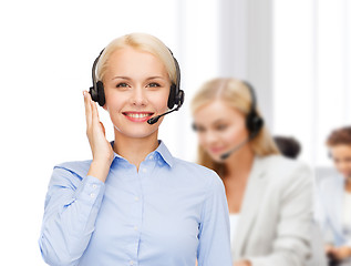 Image showing friendly female helpline operator