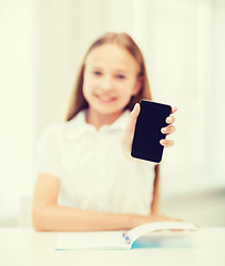 Image showing smiling student girl with smartphone at school