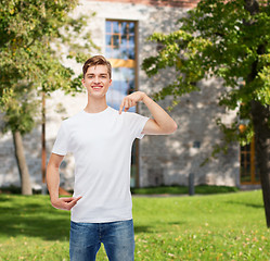 Image showing smiling young man in blank white t-shirt