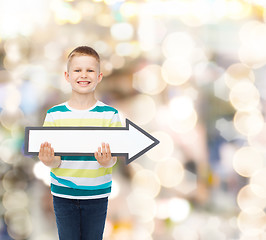 Image showing smiling little boy with blank arrow pointing right