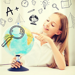 Image showing student girl with globe at school