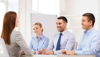 Image showing smiling businesswoman at interview in office