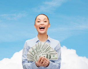 Image showing laughing businesswoman with dollar cash money