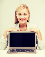 Image showing smiling woman with laptop pc