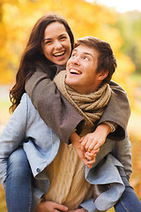 Image showing smiling couple hugging in autumn park