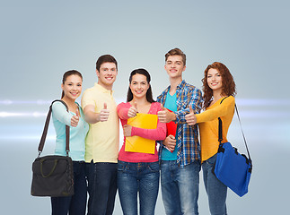 Image showing group of smiling teenagers showing thumbs up