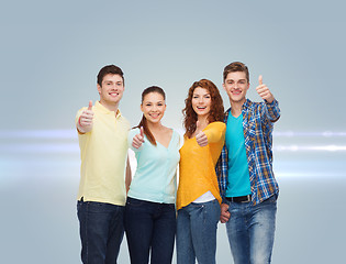 Image showing group of smiling teenagers showing thumbs up