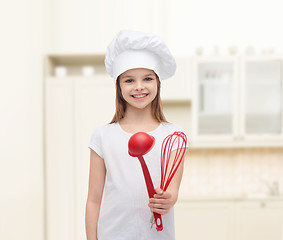 Image showing smiling girl in cook hat with ladle and whisk