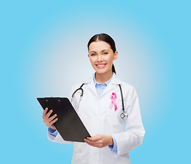 Image showing female doctor with stethoscope and clipboard