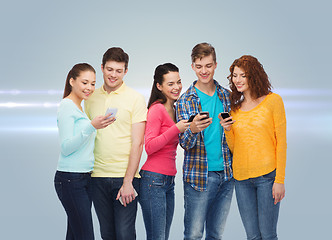 Image showing group of smiling teenagers with smartphones