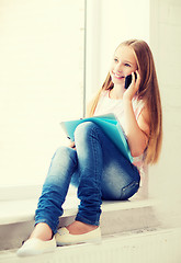 Image showing girl with smartphone at school