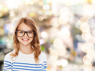 Image showing smiling cute little girl with black eyeglasses