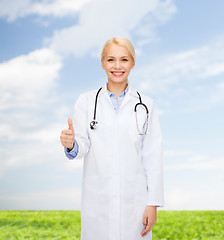 Image showing smiling female doctor showing thumbs up