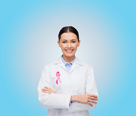 Image showing smiling female doctor with cancer awareness ribbon