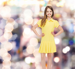 Image showing smiling little girl in yellow dress