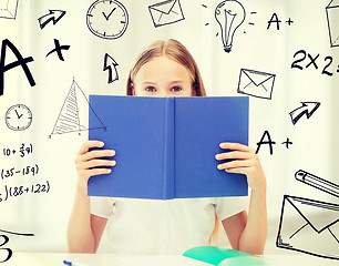 Image showing girl studying and reading book at school