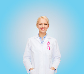 Image showing smiling female doctor with cancer awareness ribbon