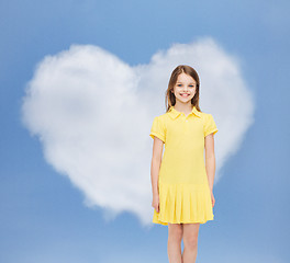 Image showing smiling little girl in yellow dress