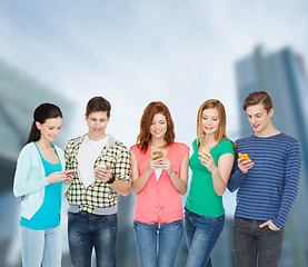 Image showing smiling students with smartphones