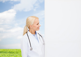 Image showing smiling female doctor with stethoscope