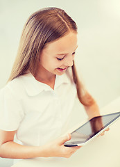 Image showing smiling girl with tablet pc at school