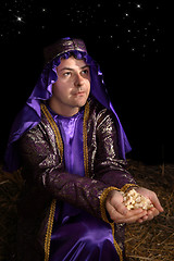Image showing Wiseman bearing gift of frankincense
