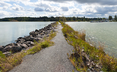 Image showing Breakwater, path and sea