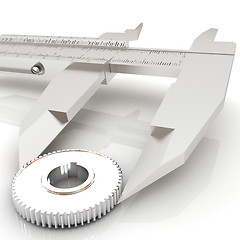 Image showing Vernier caliper measures the cogwheel 