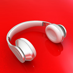Image showing White headphones isolated on a red background 