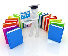 Image showing 3d man in graduation hat working at his laptop and books 